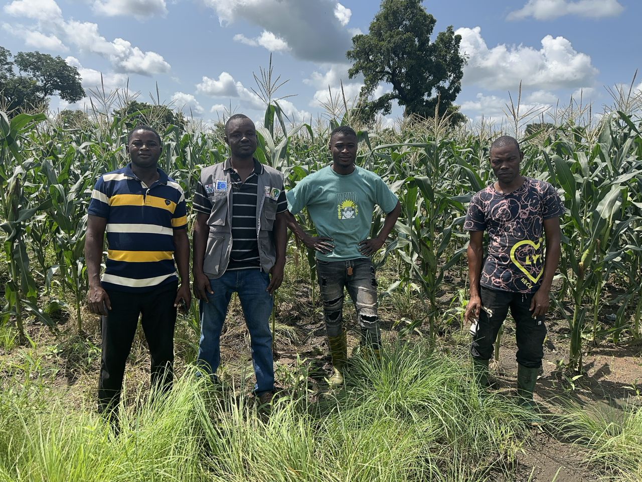 CEO AND SECRETARY WITH OFFICIALS AT THE FARM
